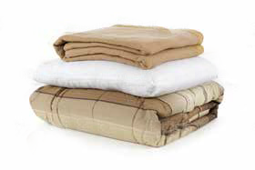 Folded used blankets and towels