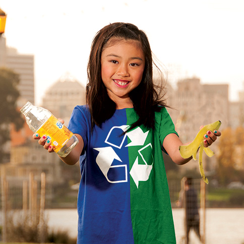 girl holding recyclable and compostable items