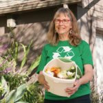 woman with compost bucket